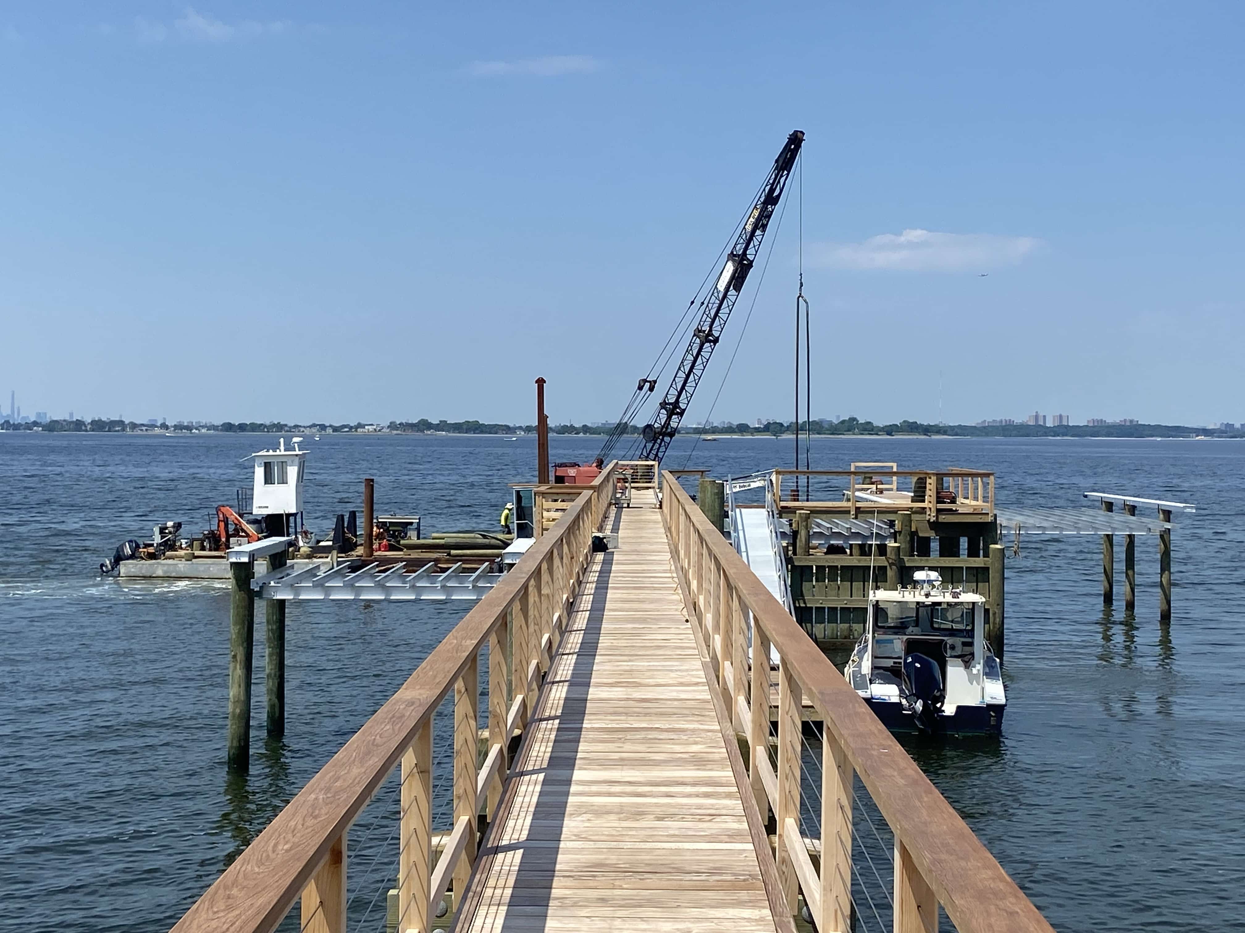 dock with boat lifts under construction